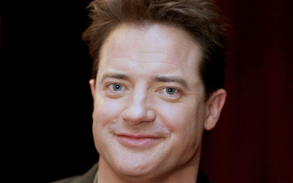 Smiling Brendan Fraser close-up portrait with natural light and soft background wallpaper fans love