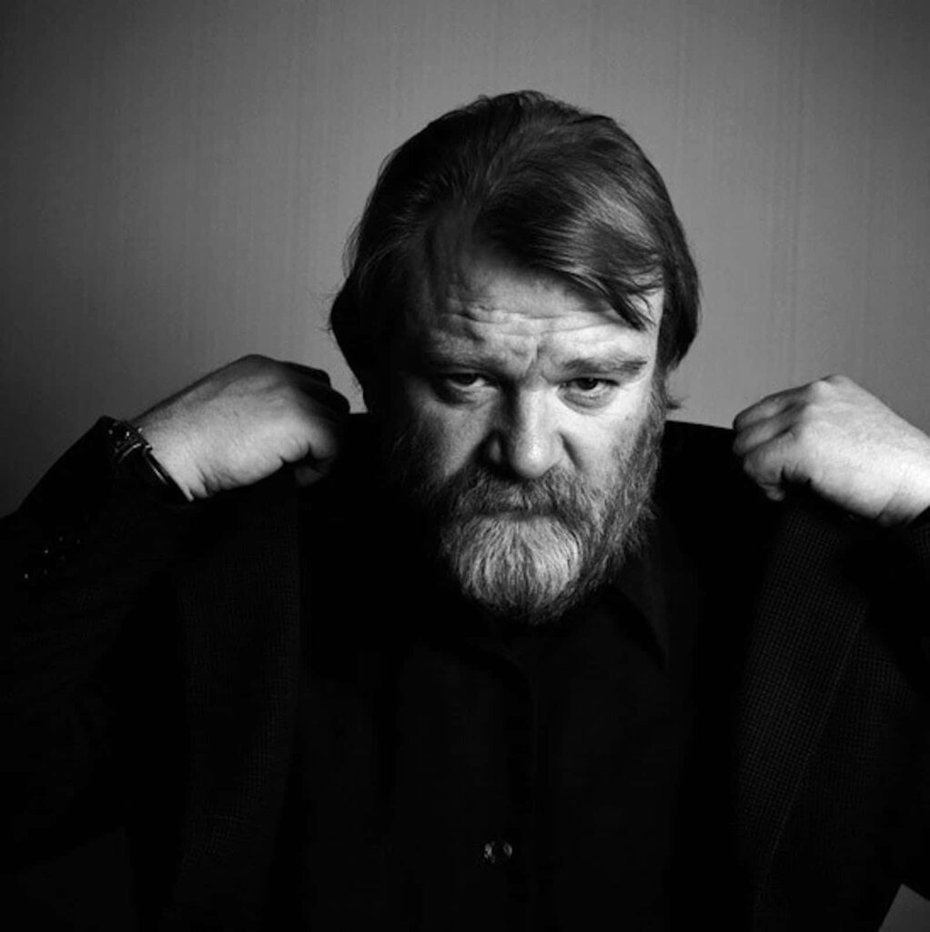 Black and white portrait of Brendan Gleeson with expressive gaze for dramatic wallpaper background
