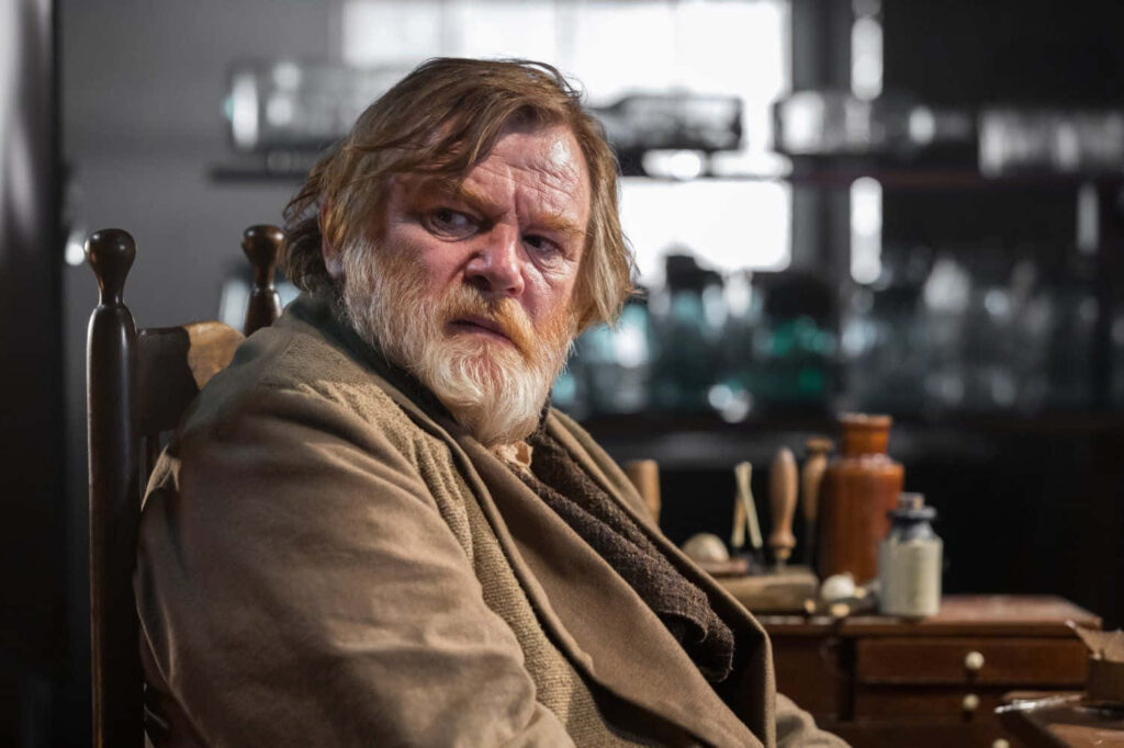 Brendan Gleeson wallpaper in rustic dramatic setting with warm earthy tones and vintage details