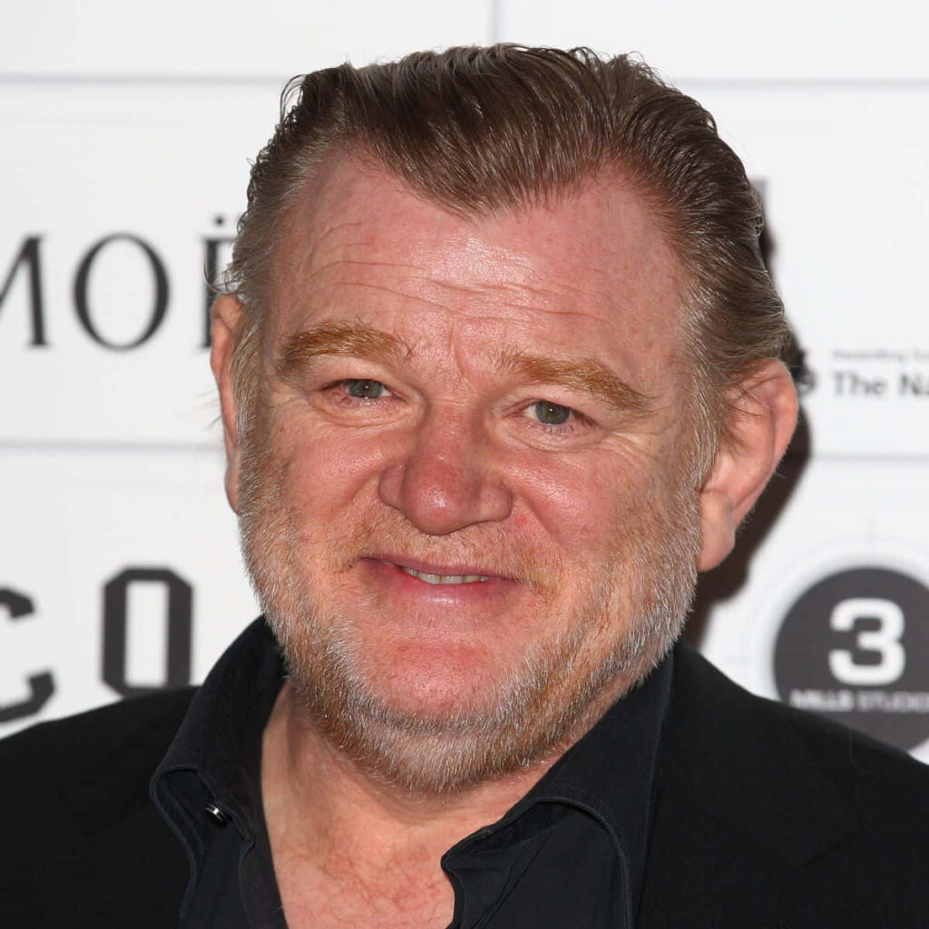 High-resolution portrait of Brendan Gleeson with warm smile on a clean professional background Wallpaper