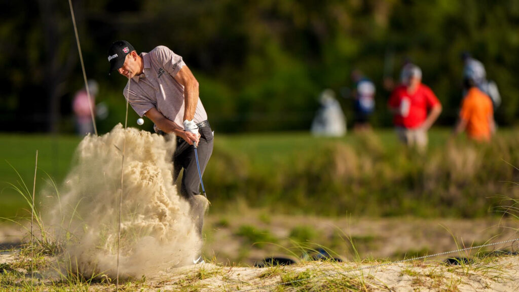 Brendan Steele golf swing with sand explosion on vibrant course intense sports action wallpaper