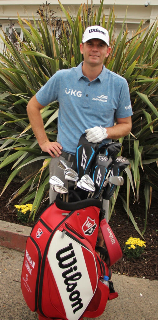 Brendan Steele with Wilson golf bag green plants wallpaper professional golfer athletic style