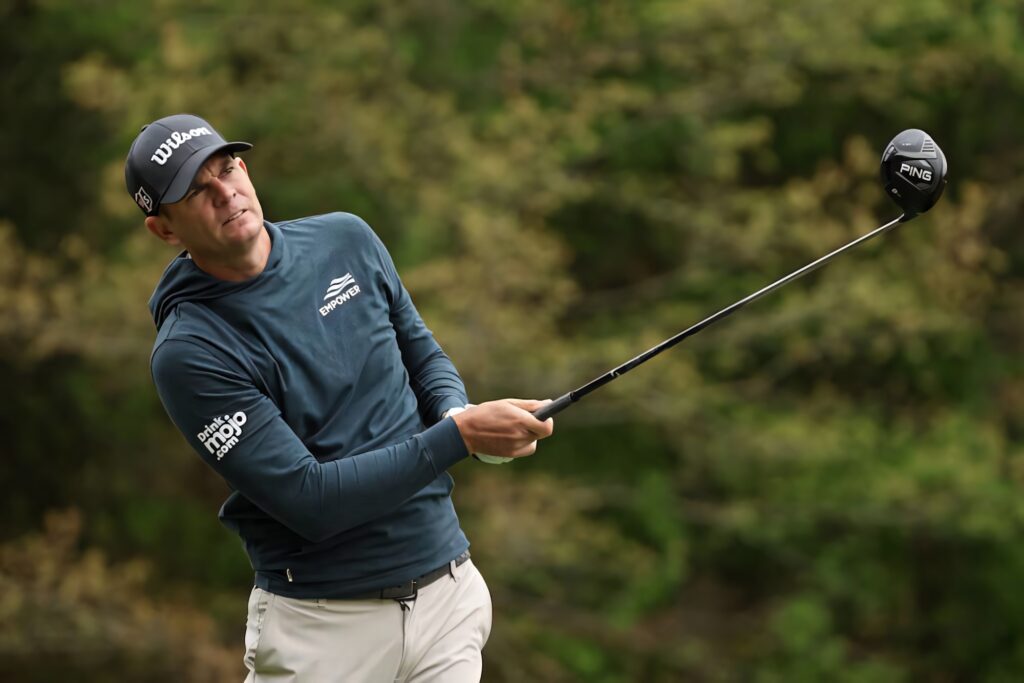 Brendan Steele focused measuring golf shot distance on lush green course high resolution wallpaper