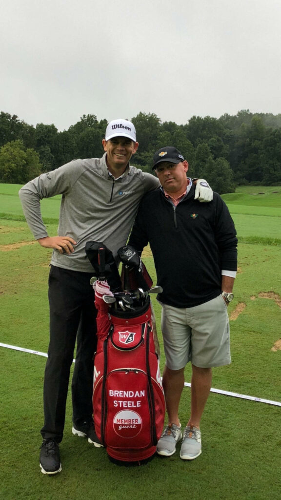 Brendan Steele and friend on lush golf course with clubs overcast sky vibrant golf wallpaper background