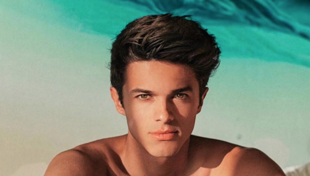 Close-up of YouTuber Brent Rivera with expressive face blue green oceanic background wallpaper