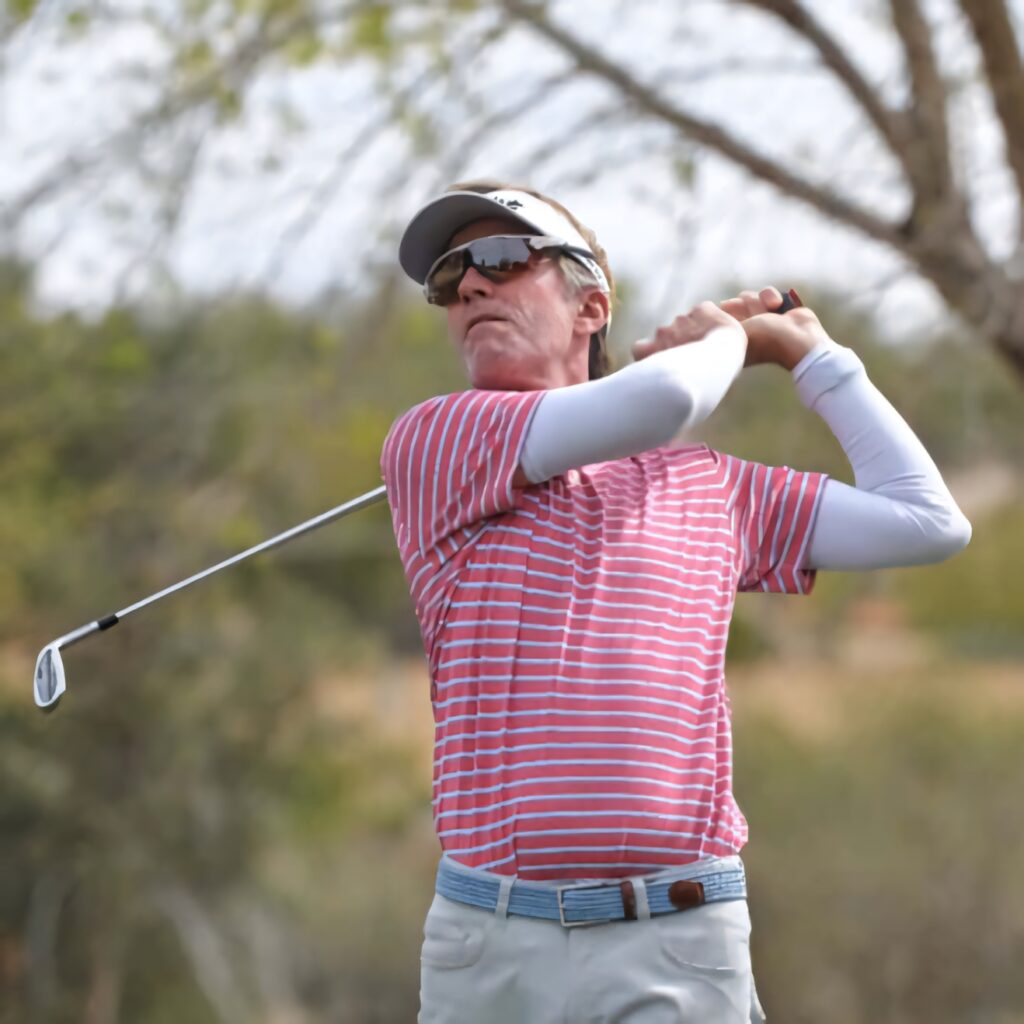 Brett Quigley mid-swing in pink striped shirt golf tournament high-resolution outdoor backdrop Wallpaper