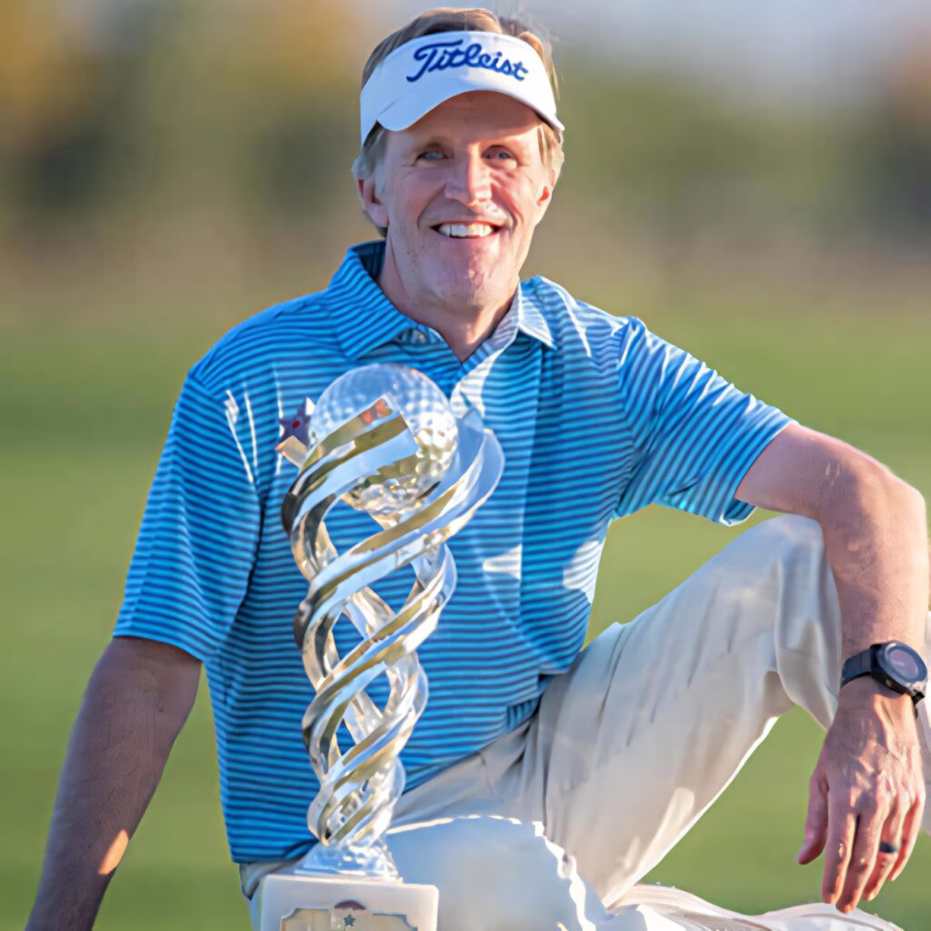 Brett Quigley professional golfer swinging on vibrant golf course in blue striped polo wallpaper