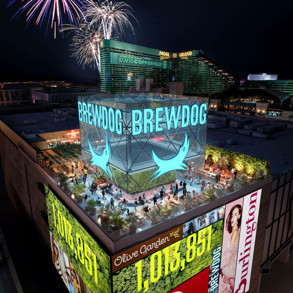 Brewdog Las Vegas rooftop bar vibrant night neon signs fireworks city lights greenery wallpaper