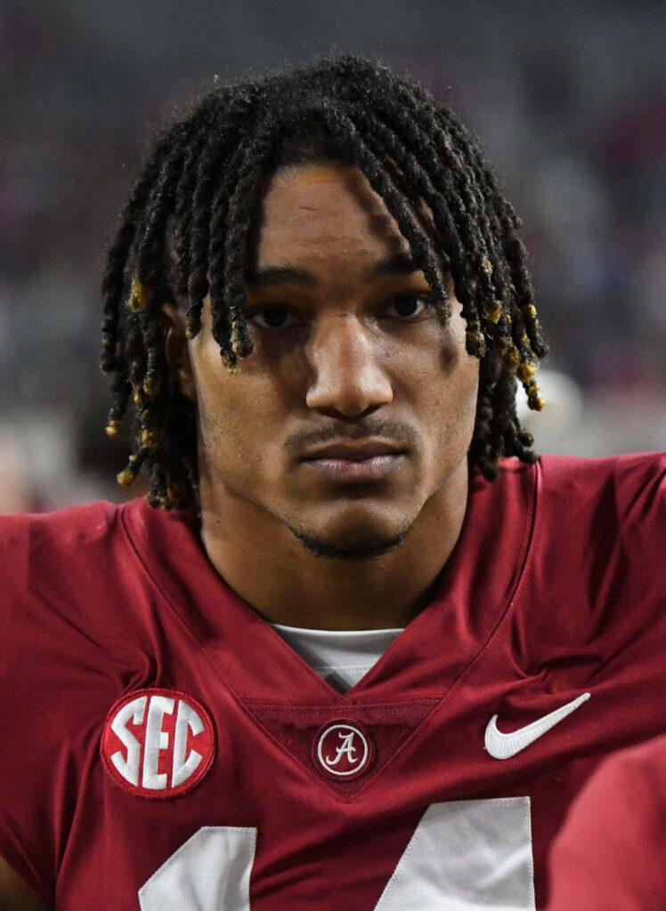 Brian Branch close-up in Alabama crimson jersey with SEC logo intense football player wallpaper