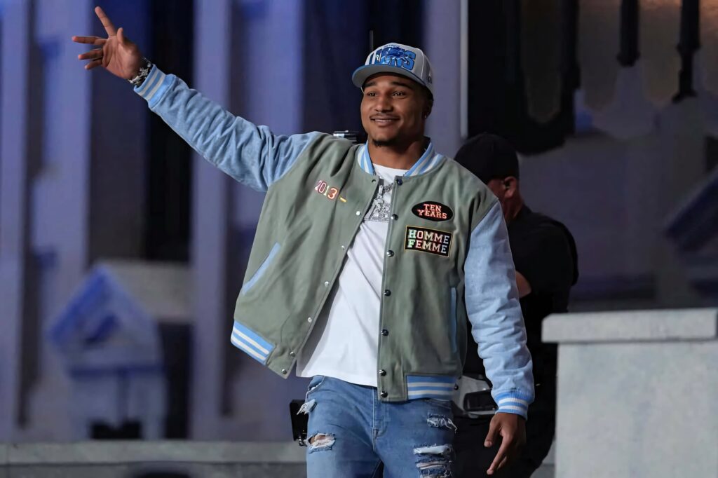 Brian Branch stylish varsity jacket distressed jeans Detroit Lions cap urban sports wallpaper