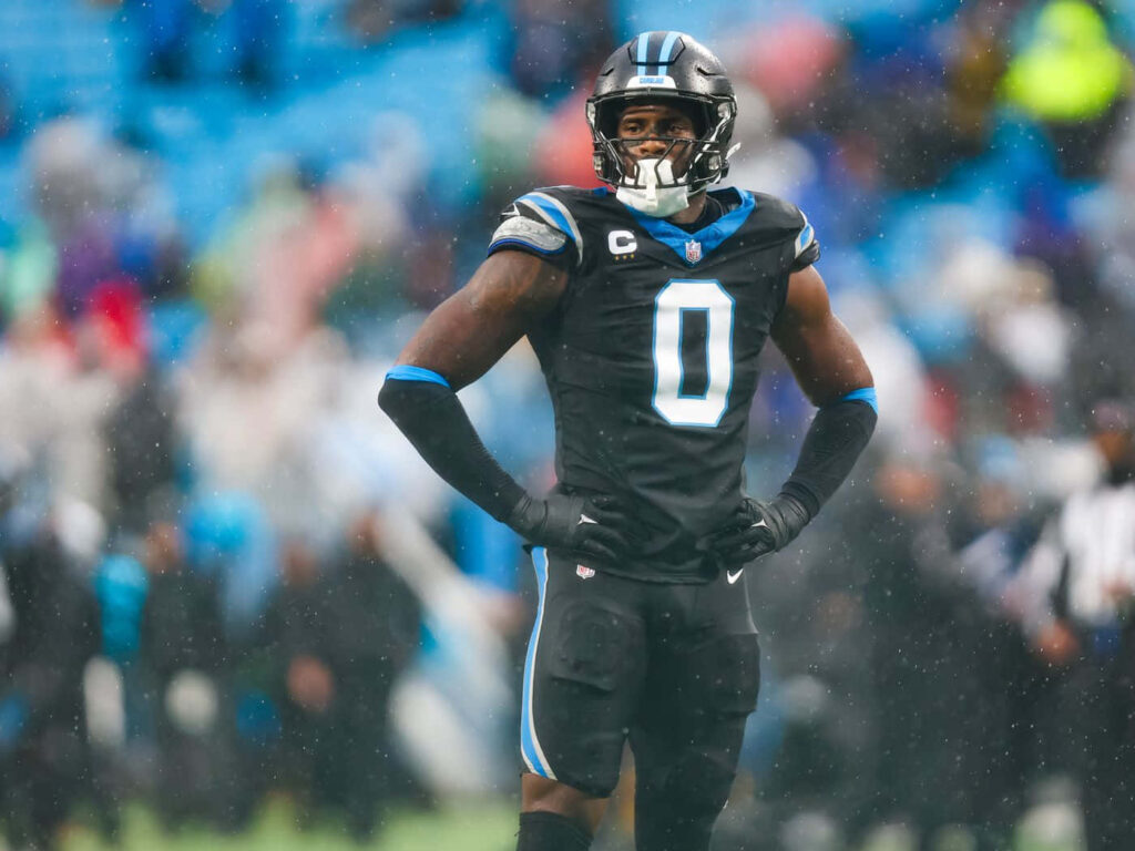 Brian Burns Carolina Panthers captain on field rainy game intense focus leadership wallpaper