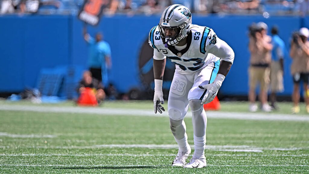 Brian Burns in Carolina Panthers uniform ready for action defensive stance high-resolution wallpaper