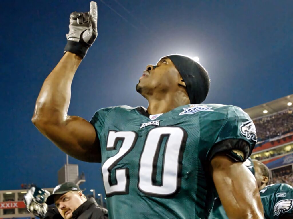 Brian Dawkins Philadelphia Eagles number 20 celebrating intensely under stadium lights wallpaper
