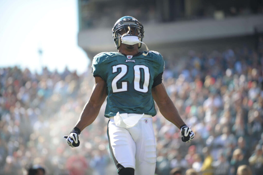Brian Dawkins number 20 celebrating in Philadelphia Eagles jersey vibrant green football wallpaper