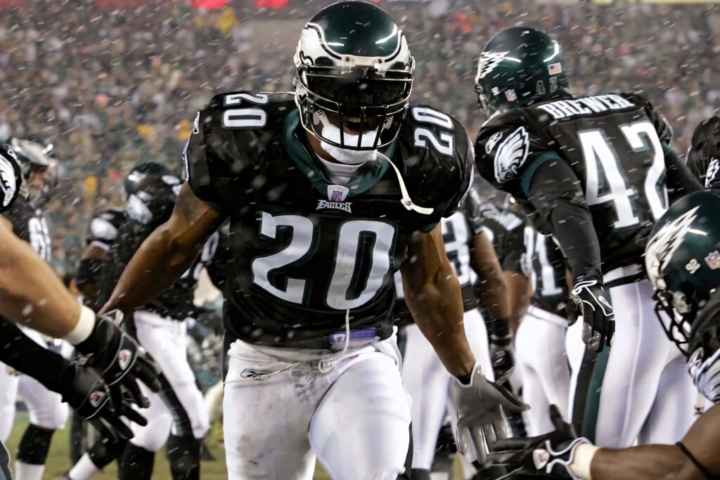 Brian Dawkins Eagles Number 20 intense football action wallpaper with vibrant stadium colors