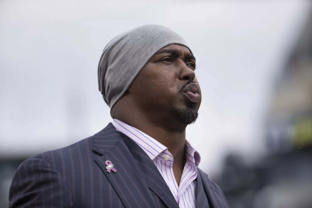 Brian Dawkins in sharp suit striped shirt gray beanie stylish NFL legend wallpaper background