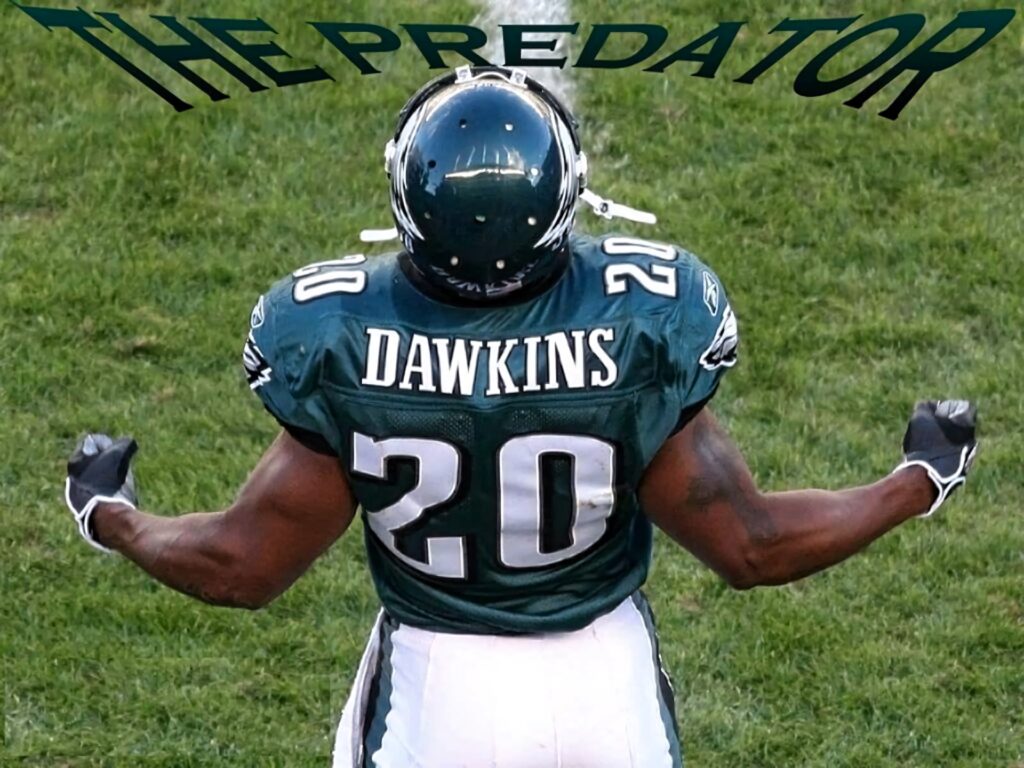 Brian Dawkins The Predator pose Philadelphia Eagles safety flexing muscles vibrant green field wallpaper