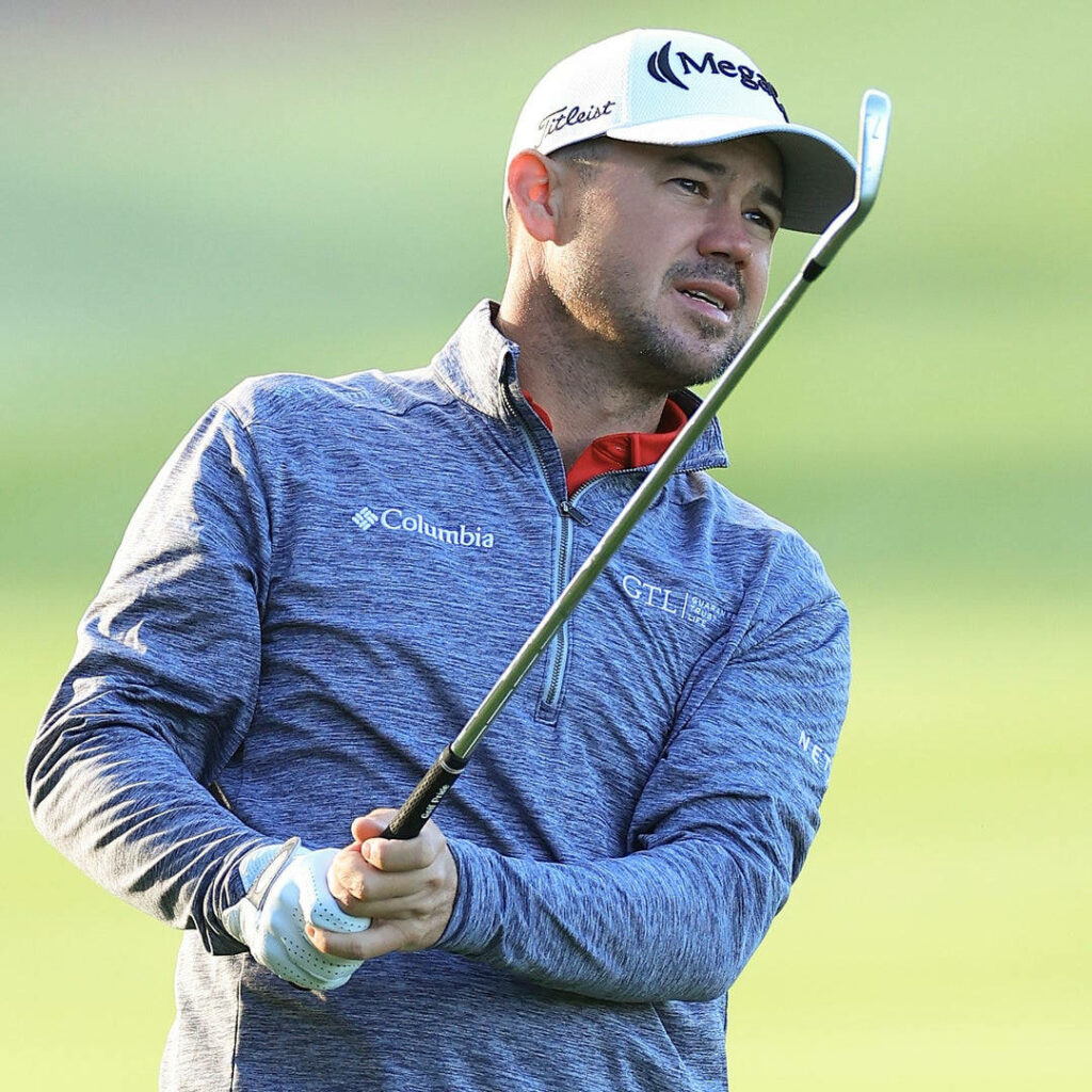 Brian Harman golfer swinging golf club on course focused expression sports attire wallpaper
