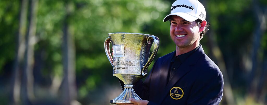 Brian Harman smiling with championship trophy outdoors vibrant greenery golf victory wallpaper