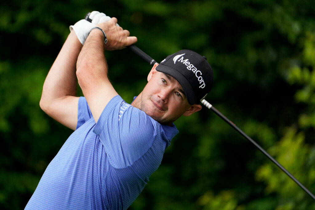 Brian Harman mid-swing professional golf wallpaper vibrant colors lush green background golf desktop