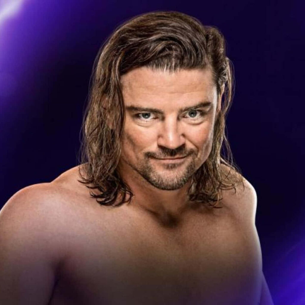 Brian Kendrick smiling confident professional wrestler purple gradient wallpaper background desktop