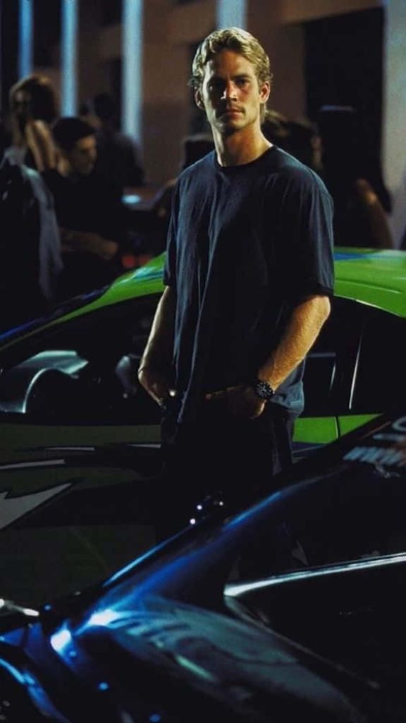 Paul Walker as Brian O'Conner with green car in moody Fast and the Furious night wallpaper