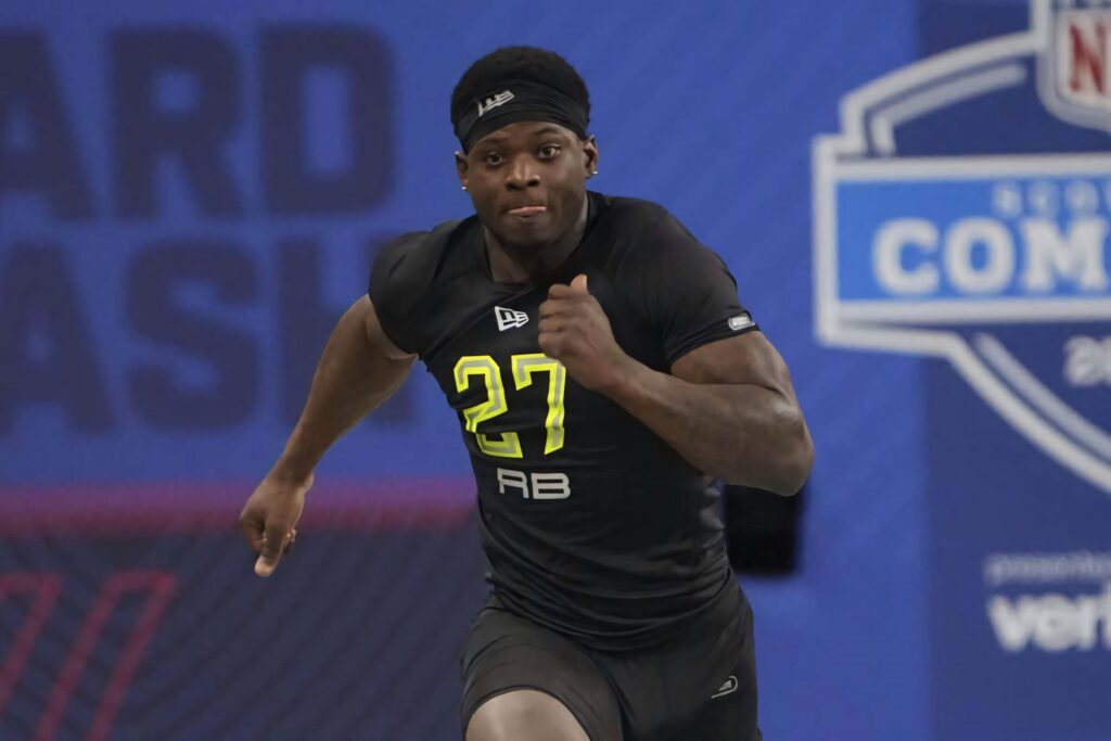 Brian Robinson Jr sprinting in black number 27 uniform during Running Back Pro Day NFL wallpaper