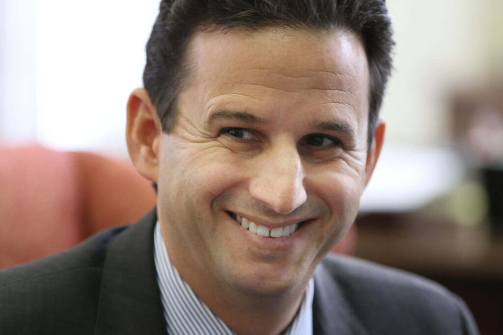 Brian Schatz smiling in business suit close-up professional inspiring wallpaper background