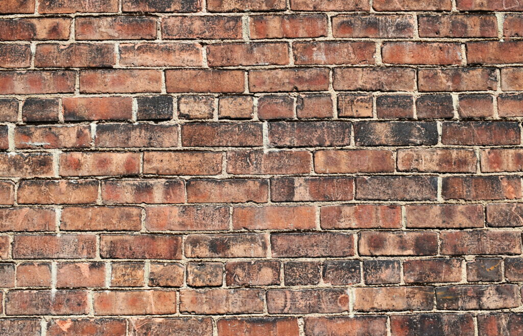 Textured Bricks: A Captivating 5K Wallpaper Featuring a Stunning Brick Wall Surface