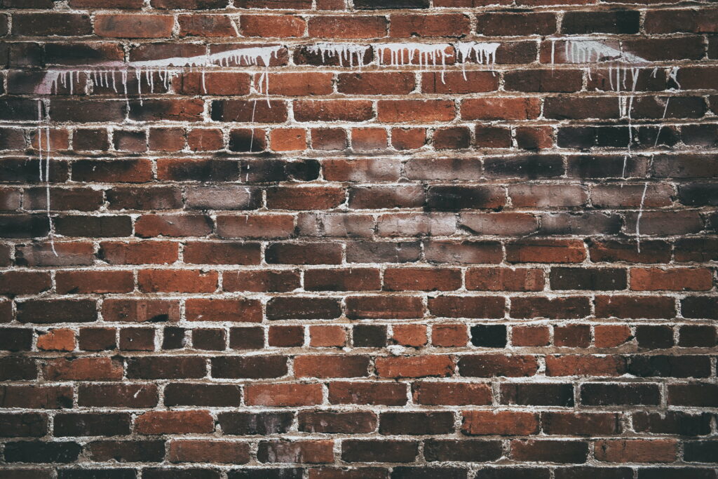 Fine Brickwork: A Captivating HD Wallpaper Showcasing Textured Paint on a Wall
