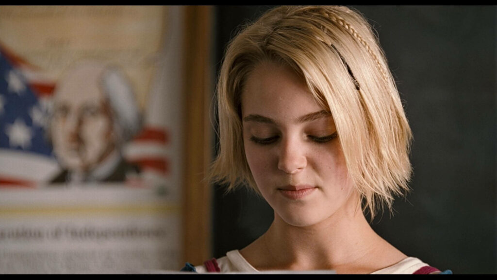 Bridge to Terabithia Leslie with short blonde hair thoughtful expression classroom wallpaper