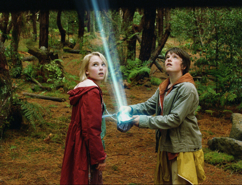Bridge To Terabithia wallpaper with Josh Hutcherson and AnnaSophia Robb in enchanted forest scene