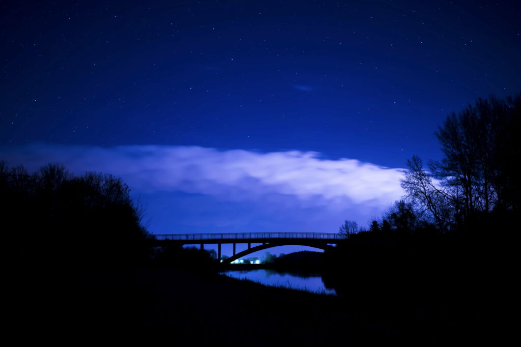 Starry Night Bridge: Captivating Nature's Nighttime Symphony Wallpaper