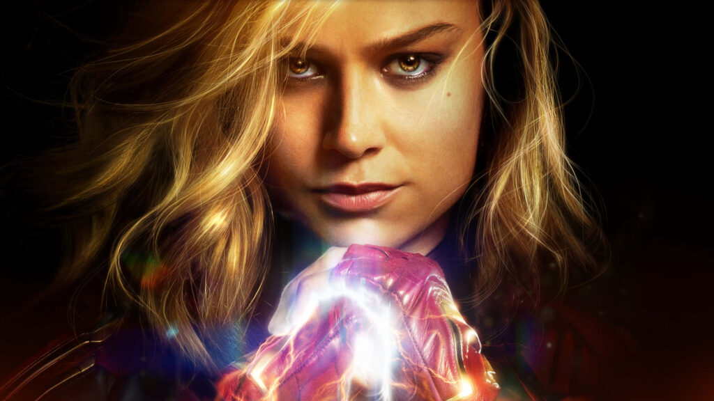 Defending Earth: Brie Larson embodies Carol Danvers, a formidable interstellar warrior, joining forces with Nick Fury in the Marvel Studios' action-packed blockbuster, Captain Marvel. Epic battle against extraterrestrial invasion awaits. Wallpaper