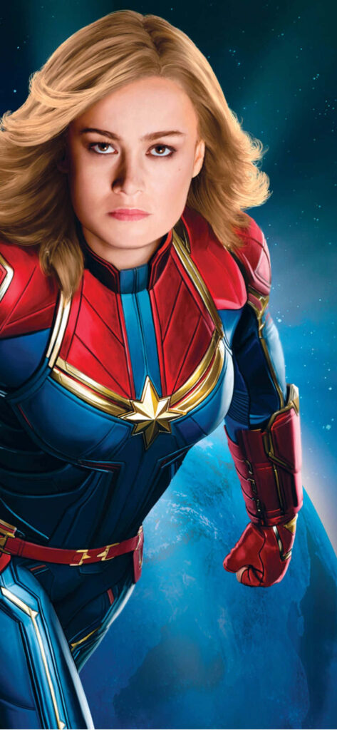 Captain Marvel Soars as a Powerful Kree Warrior, Harnessing Cosmic Energy & Flight in Marvel Cinematic Brilliance Wallpaper