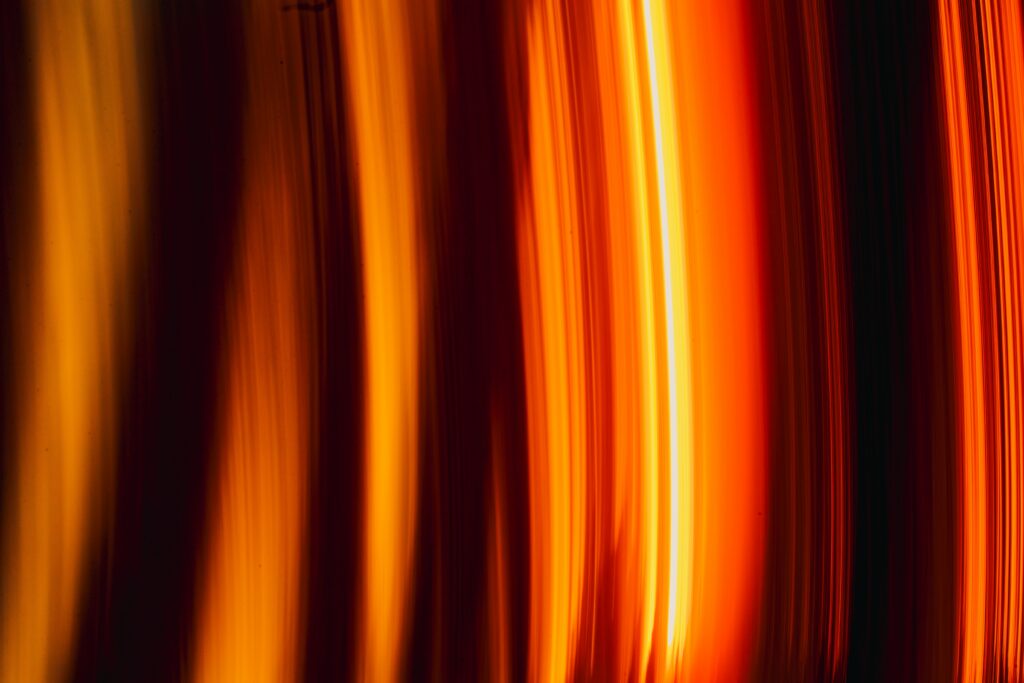 Vibrant Abstract Wallpaper: Warm Streaks of Light for Dynamic Background