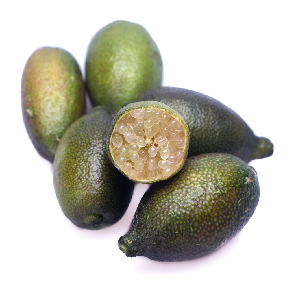 High-res food photo of Australian finger limes with citrus caviar on white background wallpaper