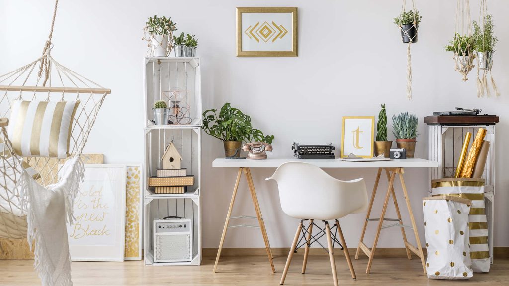 Bright Muji-style home office with white desk chair hammock plants warm gold accents background Wallpaper