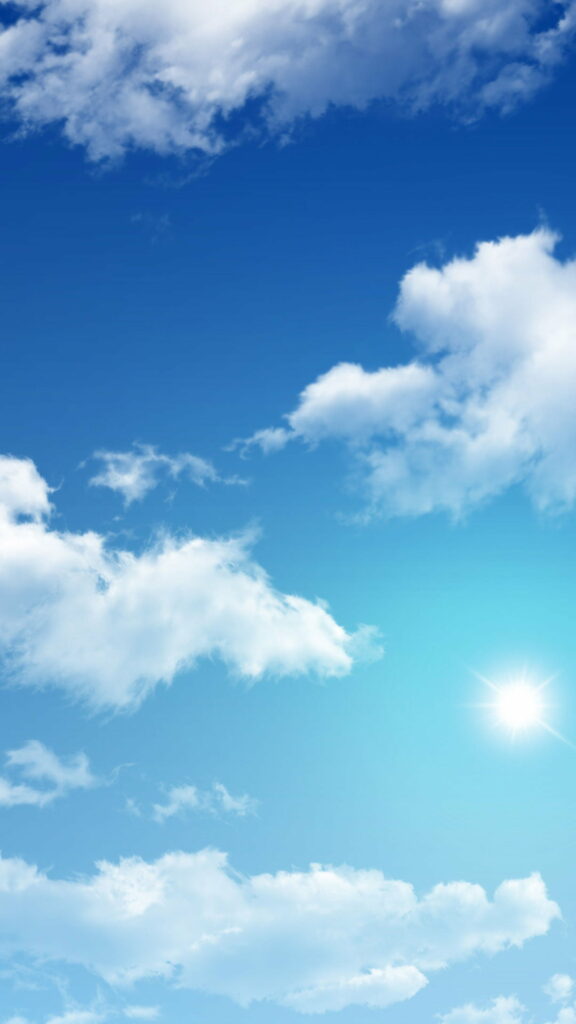 Bright Blue Sky Wallpaper: Fluffy Clouds & Sunshine Tranquility