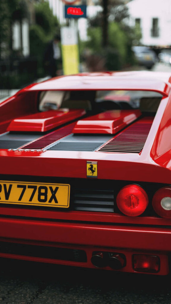 Timeless Elegance: A Dazzling Classic Red Ferrari Commands Attention Wallpaper
