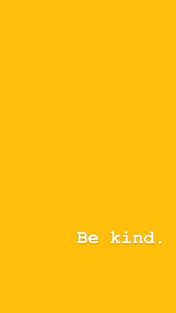 Bright yellow wallpaper with uplifting Be kind white text positive motivational background