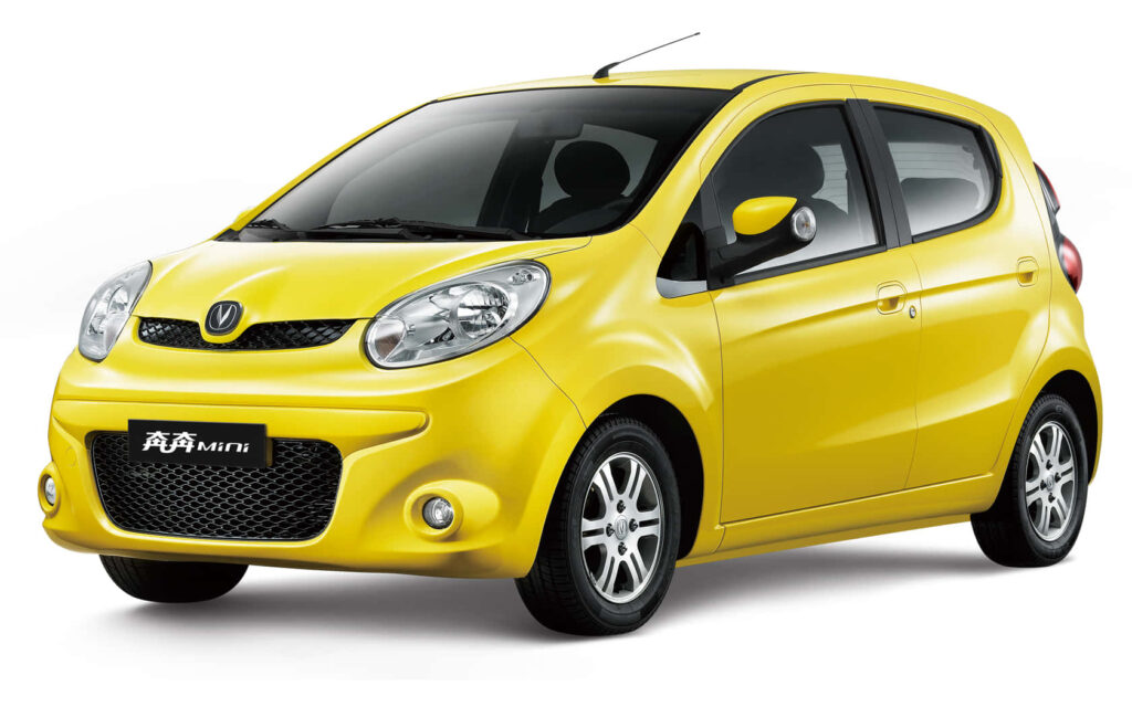 Changan Mini bright yellow city car with sleek black accents on clean white background wallpaper