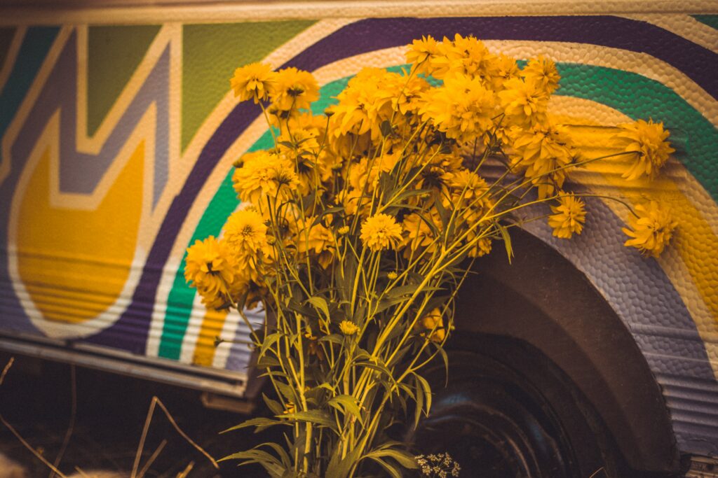 Vibrant Yellow Flower Bouquet Against Artistic Background Wallpaper