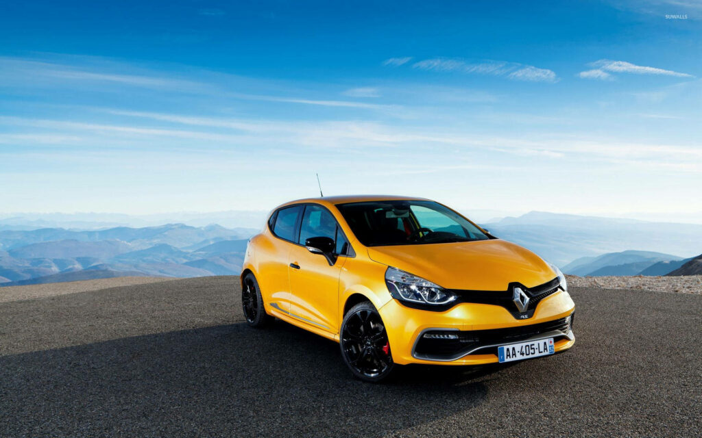 Stunning Yellow Renault Car Wallpaper Against Mountainous Landscape