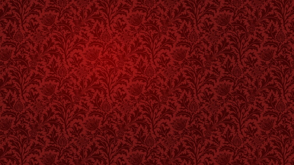 Elegant red floral damask wallpaper with rich crimson maroon hues and subtle vignette lighting