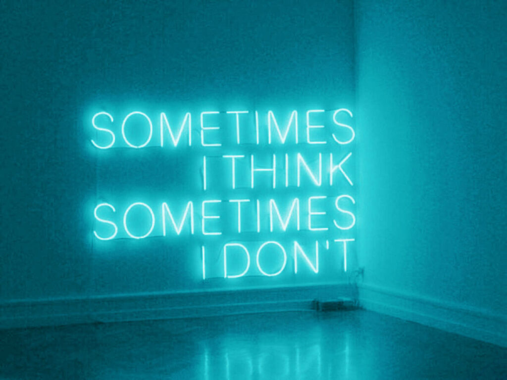 Reflective Illumination: Contemplation Amid a Cyan Background Wallpaper