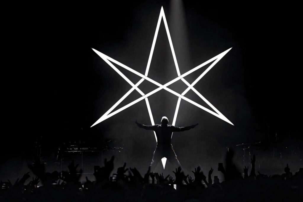 Silhouetted Bring Me the Horizon performer with glowing starlight symbol and energetic crowd wallpaper
