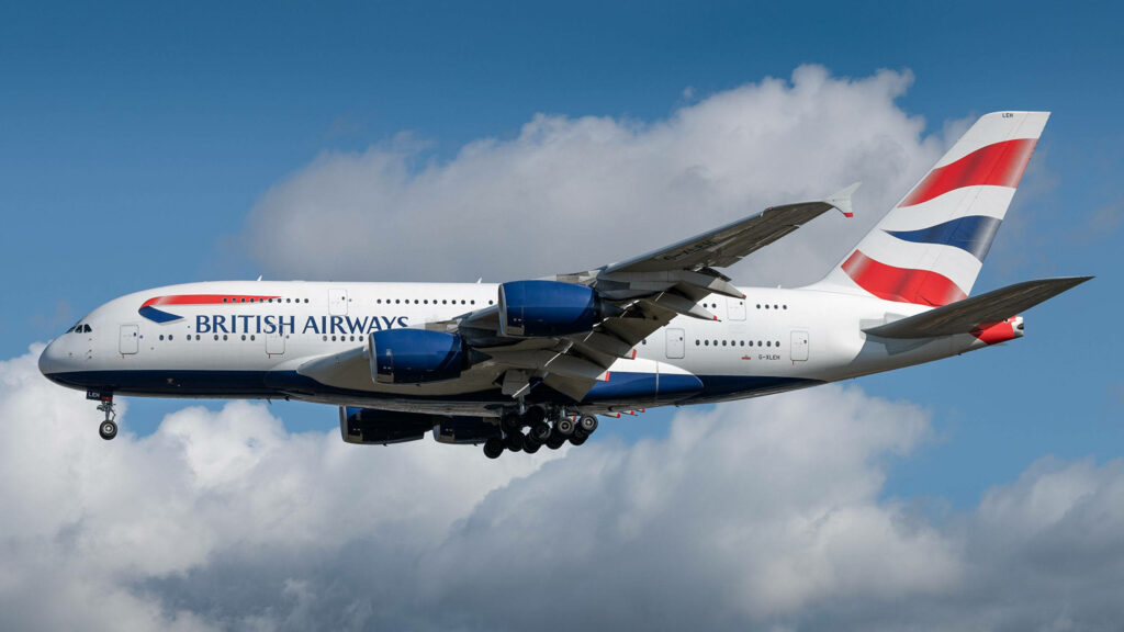 British Airways Airbus flying high in blue sky with clouds showcasing modern aircraft design Wallpaper