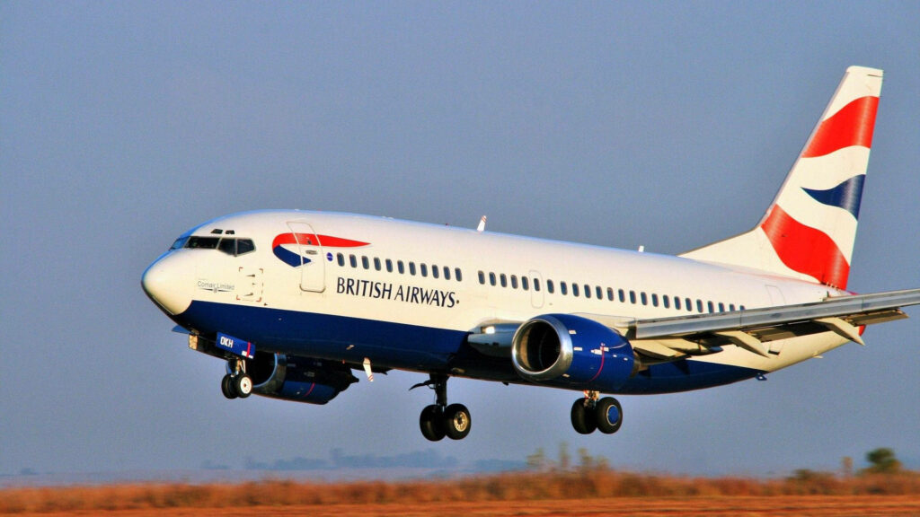 British Airways airplane landing on runway with clear skies blue red white livery wallpaper
