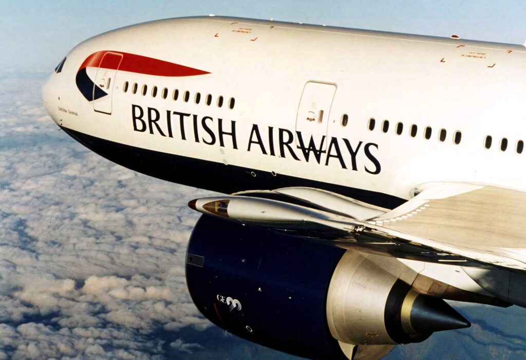 British Airways airplane side view with signature livery flying above clouds aviation wallpaper